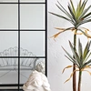 Close up view of Modern Industrial Grid Black Full-Length Mirror with Black Finish and plant
